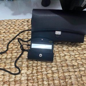 Cute little Black clutch with optional shoulder strap and lipstick holder.
